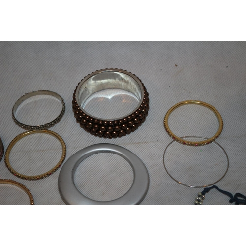 50 - An assortment of Costume Jewellery Bangles