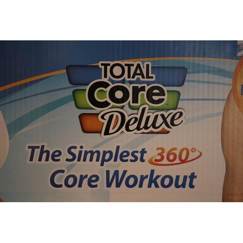 51 - A Boxed Total Core Deluxe workout apparatus and a boxed Body Trim (electric pulse} Untested