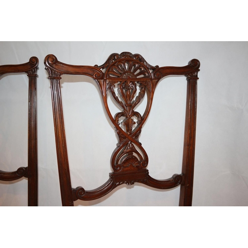 54 - Two nursery chairs with ornate carved backs complete with original casters