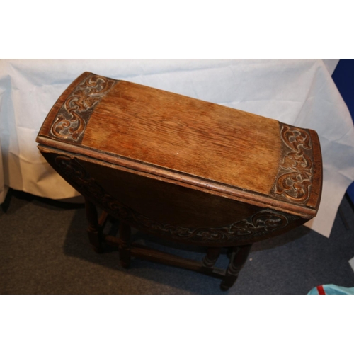 75 - Highly Carved Drop Leaf serving table. Aged