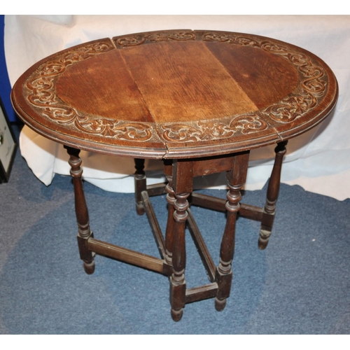 75 - Highly Carved Drop Leaf serving table. Aged