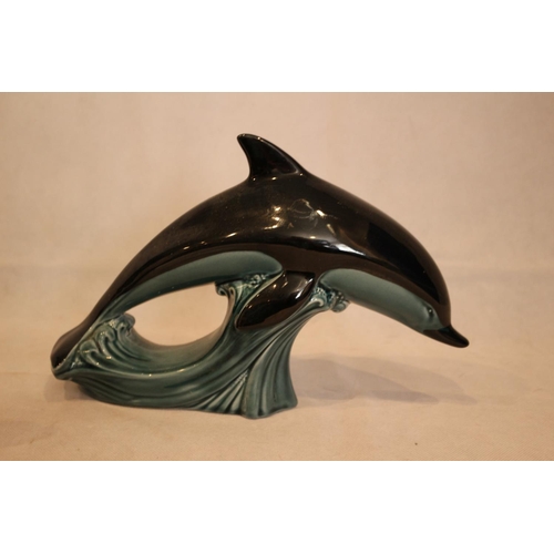 78 - A Large Poole pottery dolphin and an unmarked Seal statue