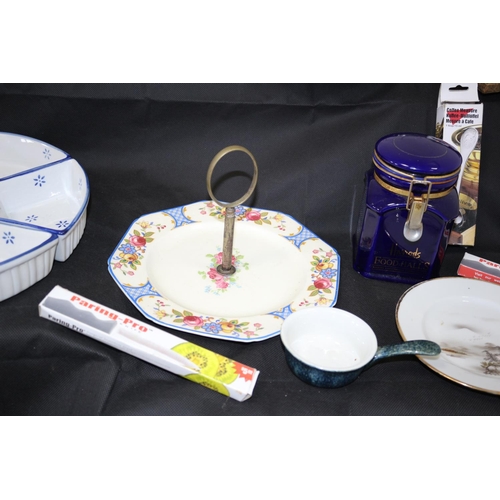 179 - An Eclectic Mix of Assorted Items Including Flatware, Lazey Susan, Plates by Alfred Meakin and a Man... 