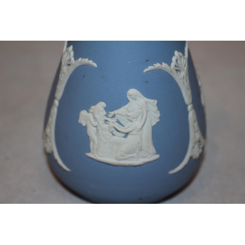 199 - A Wedgewood Jasper Ware In Blue & White Rose Stem Vase