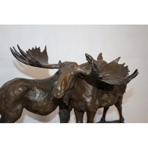 209 - A Beautiful Bronze Sculpture Of A Male and Female Moose Mounted On A Heavy Black Marble Base  Sculpt... 