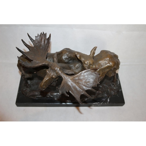 209 - A Beautiful Bronze Sculpture Of A Male and Female Moose Mounted On A Heavy Black Marble Base  Sculpt... 