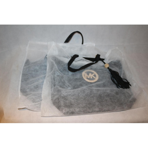 247 - 2 New black handbags in dust covers