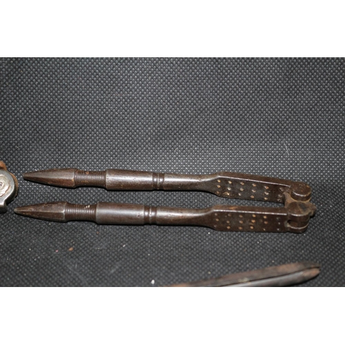 293 - A pair Of Vintage Metal NutCrackers and Hair Curler Irons