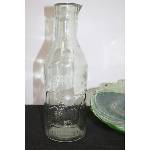 295 - A Large Green Swirl Pattern Cake Server/Platter and An Absolutely Pure Milk Pouring Bottle