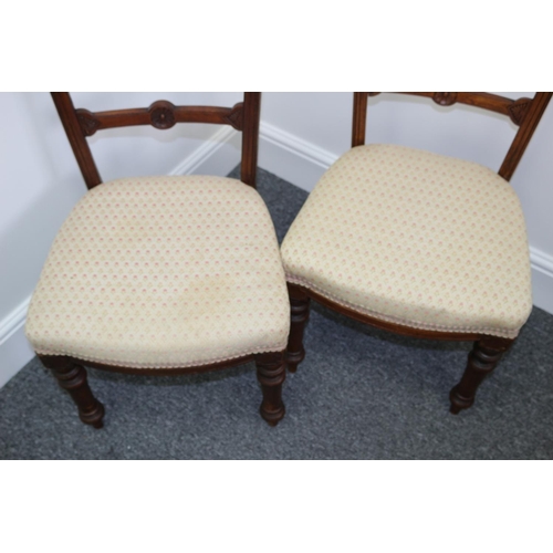 308 - Two Wooden Hall Chairs with Carved motif Backs and Turn Front Legs. One needs back tightening