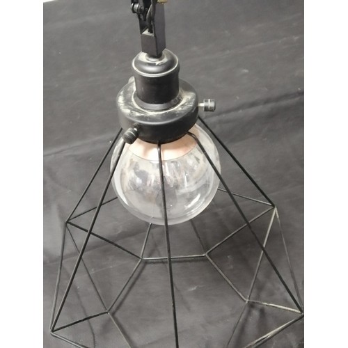 12 - An Industrial Style Bike Chain Hung Ceiling Light Complete with Bulb and Cage Style Shade Was In Wor... 