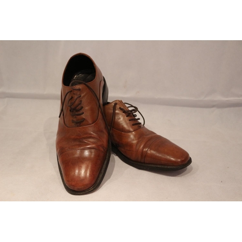 214 - A pair of brown Mark and Spencer's lace up shoes. Believed to be size 9