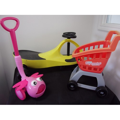 3 - 3 Children's Toys Including Sit on Ride On  Vehicle A bubble Machine And A Shopping Trolley