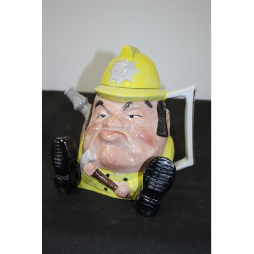 231 - 3 Teapots Including a Grumpy Looking Staffordshire Fireman, A Royal Doulton Carmel, and a Biltons of... 