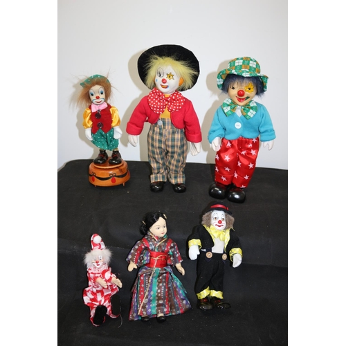 402 - An assortment of Doll Like Characters Including Japanese Porcelain doll