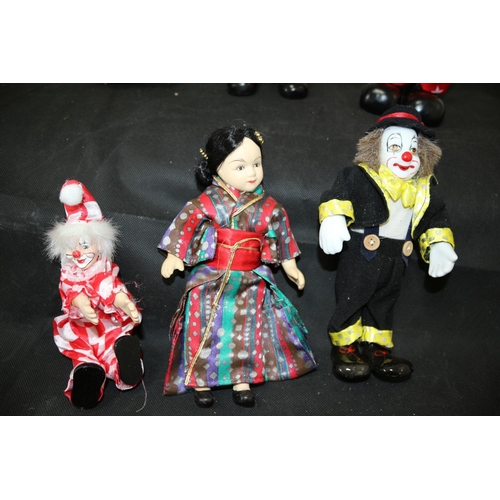 402 - An assortment of Doll Like Characters Including Japanese Porcelain doll