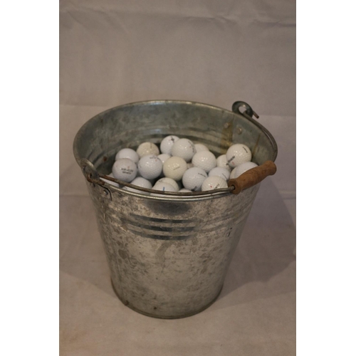 436 - A great one for you golfers, a galvanized bucket full of used golf balls