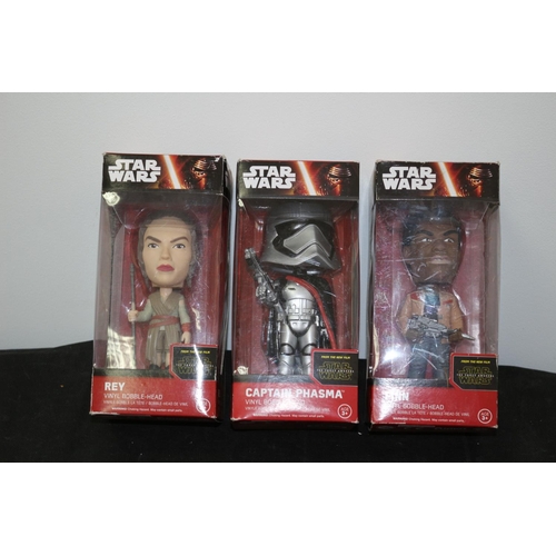 188 - From Star Wars The Force Awakens Vinyl Bobble Head In Boxes Finn, Captain Phasma and Rey