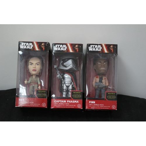 188 - From Star Wars The Force Awakens Vinyl Bobble Head In Boxes Finn, Captain Phasma and Rey