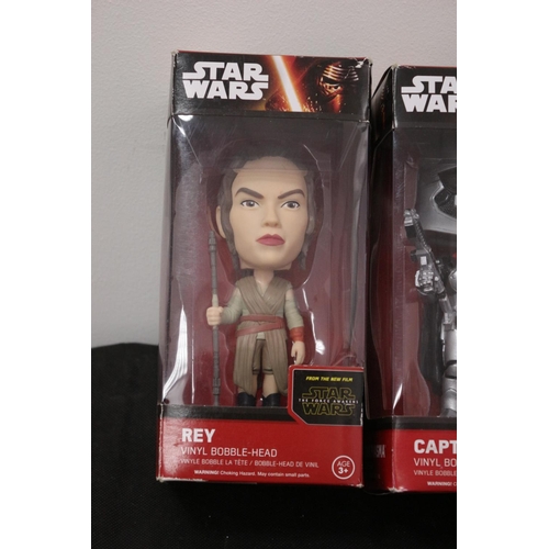 188 - From Star Wars The Force Awakens Vinyl Bobble Head In Boxes Finn, Captain Phasma and Rey