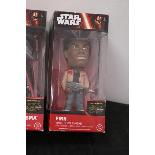 188 - From Star Wars The Force Awakens Vinyl Bobble Head In Boxes Finn, Captain Phasma and Rey