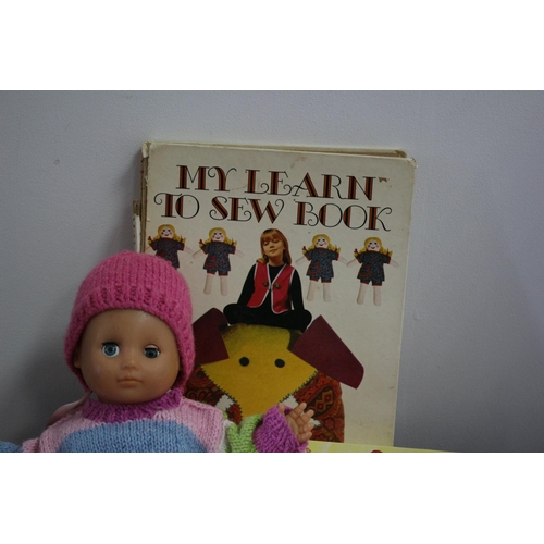 470 - Birth Certificate Holder, 2 Dolls and Book on My Learn to Sew Book