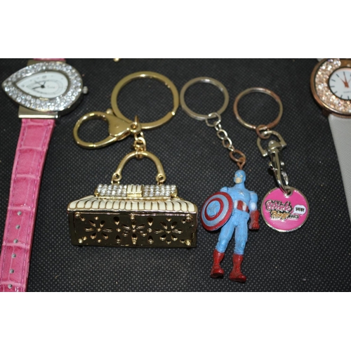 515 - 3 Wrist Watches A Small Crystal Clock and Some Key Rings