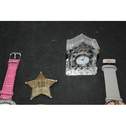 515 - 3 Wrist Watches A Small Crystal Clock and Some Key Rings