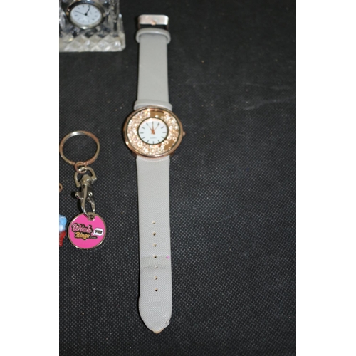 515 - 3 Wrist Watches A Small Crystal Clock and Some Key Rings