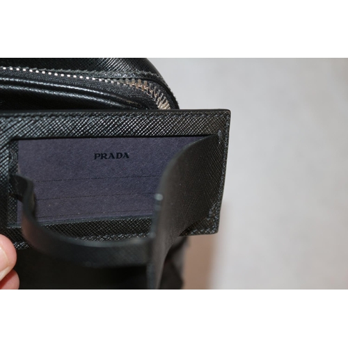 542 - Prada Handbag With Documentation And Dust Bag. Some Small Scuffing