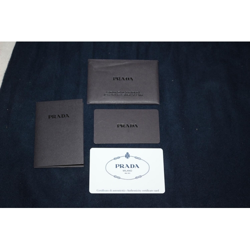 542 - Prada Handbag With Documentation And Dust Bag. Some Small Scuffing