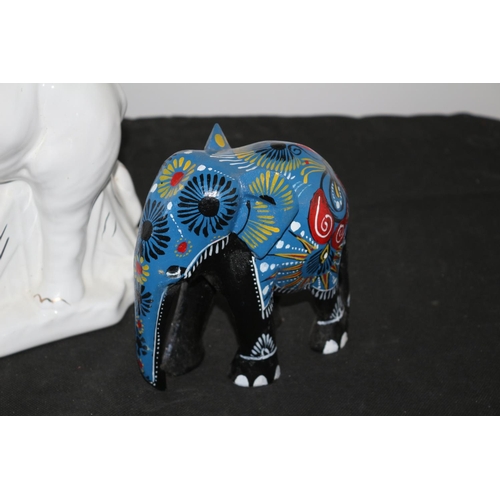 550 - A Selection of Elephants 2 china and 1 wooden white china elephant has slight chip to ear