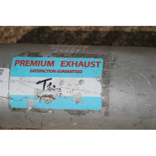 19 - An Assortment Of Exhaust Pipes And Silencers  Having Sticker Premier Exhausts