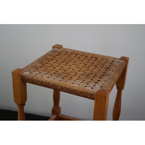 28 - A Tall Mid Century Foot Stool with Wicker Woven Rattan and Wood turned Legs