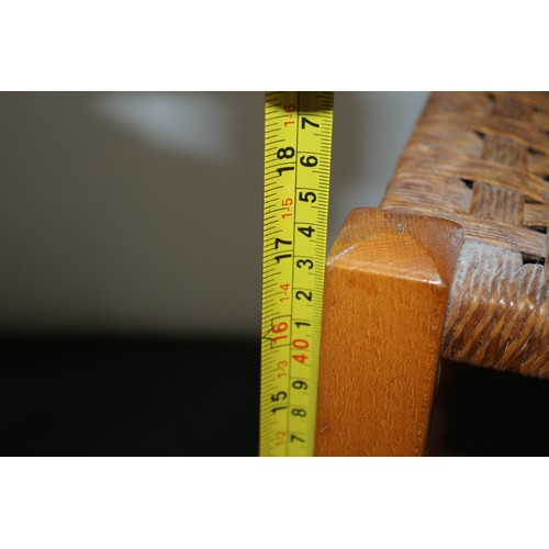 28 - A Tall Mid Century Foot Stool with Wicker Woven Rattan and Wood turned Legs