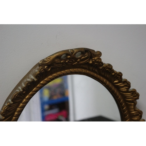 49 - A Gold Painted Framed Composite Oval Mirror