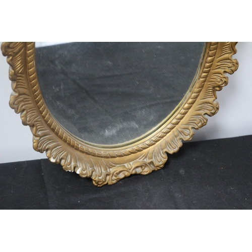 49 - A Gold Painted Framed Composite Oval Mirror