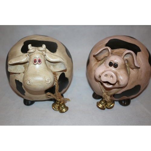 67 - 2 Resin Garden ornaments in the Style of a Pig and Cow