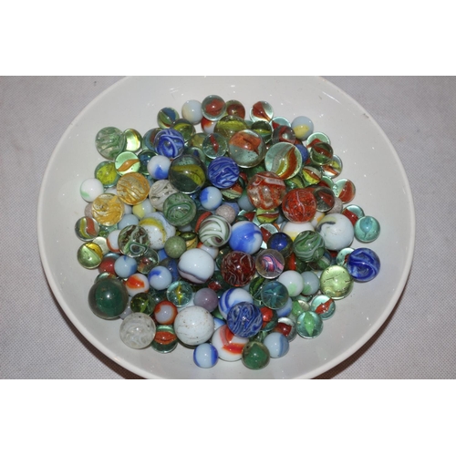 70 - A Bowl with a Large Assortment of Various aged Marbles