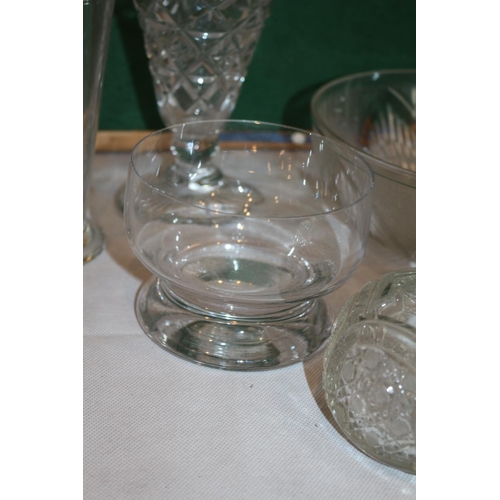 272 - An assortment of Clear glass ware items including cups and vases