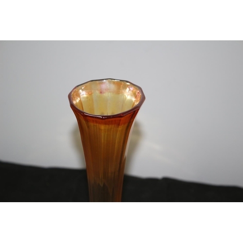 379 - A Carnival Glass Twist Stem Vase 25 CM High. Slight Chip To Base