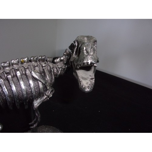 385 - Metal Effect Dinosaur Skeleton sculpture. Sadly Tail Has Damage