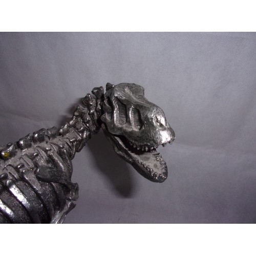 385 - Metal Effect Dinosaur Skeleton sculpture. Sadly Tail Has Damage