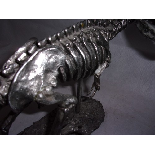 385 - Metal Effect Dinosaur Skeleton sculpture. Sadly Tail Has Damage