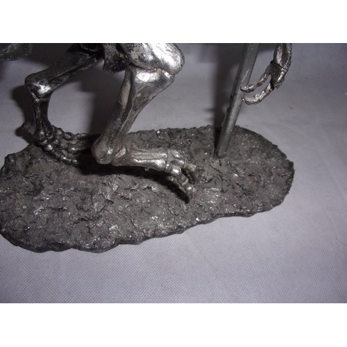 385 - Metal Effect Dinosaur Skeleton sculpture. Sadly Tail Has Damage