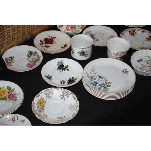 611 - Wicker Basket with Large Selection of Saucers and Tea-Plates, 2 x Cups and a Figurine