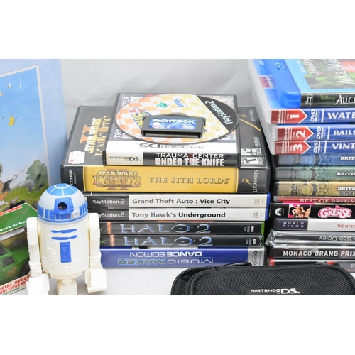 127 - DVD's, A Metal Tin with a Cup and Saucer and gaming Items and a Model Van