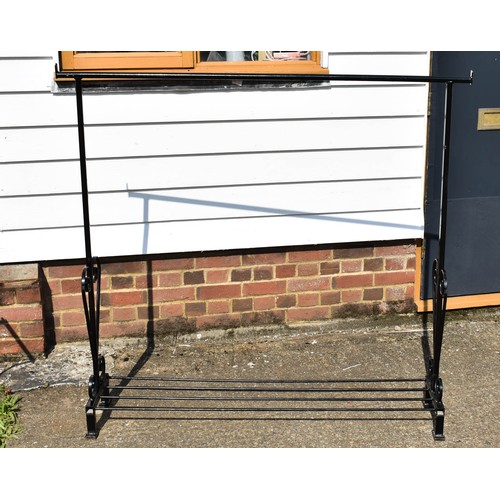 42 - A Black Metal Clothes Rail With Ornate Side Detailing