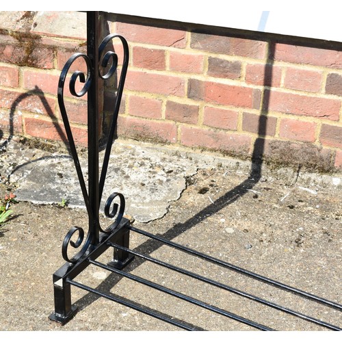 42 - A Black Metal Clothes Rail With Ornate Side Detailing