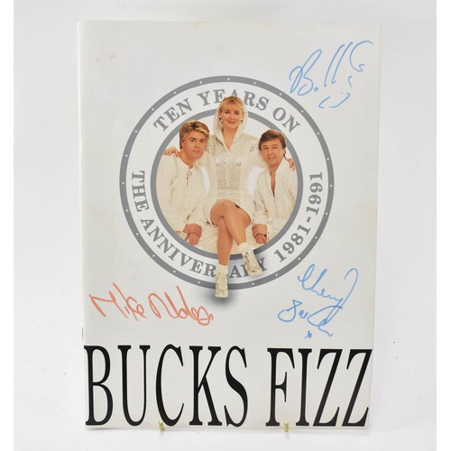 93 - Bucks Fizz Memorabilia, including Tour Programmes ( one signed) and Photo Album with Signatures